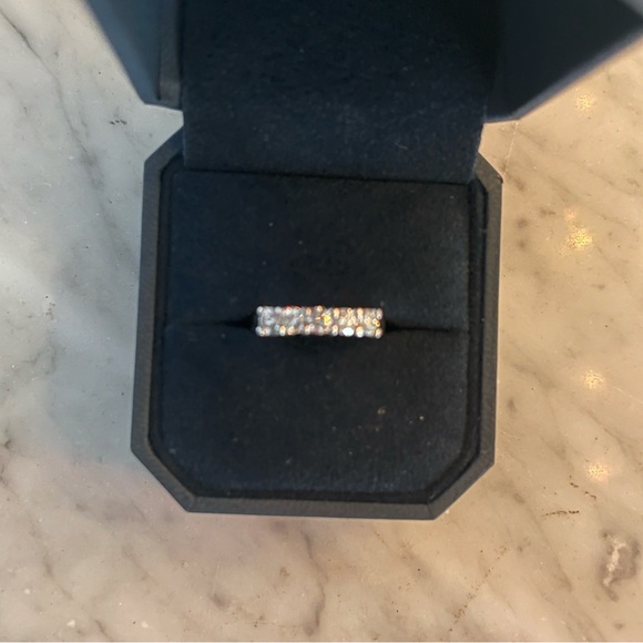 Five stone diamond and platinum anniversary band.